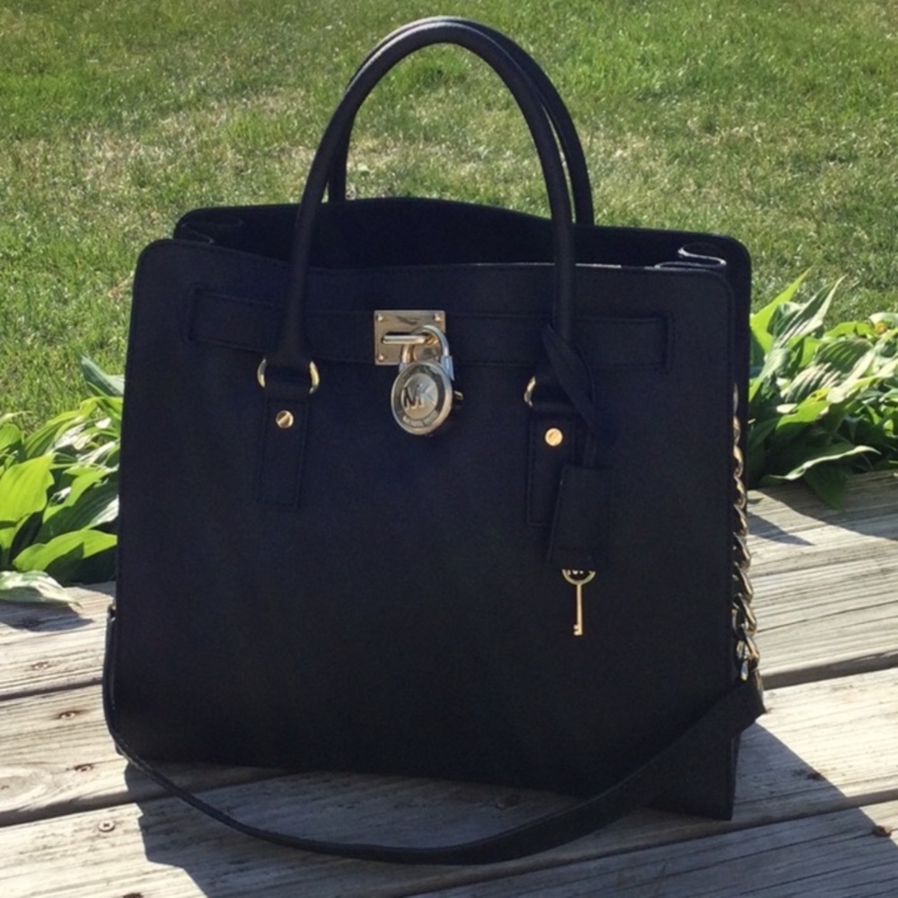 Michael Kors black and gold Hamilton bag. Basically brand new- only used once.